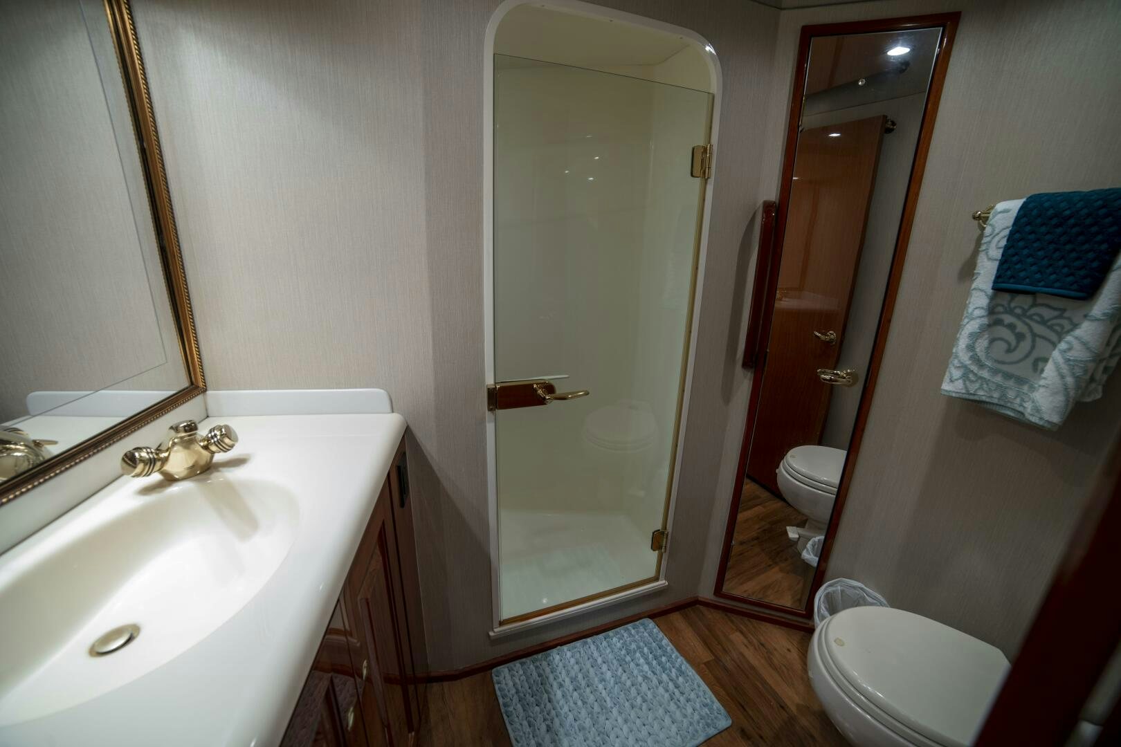 a bathroom with a glass shower door aboard PRIME TIME Yacht for Sale