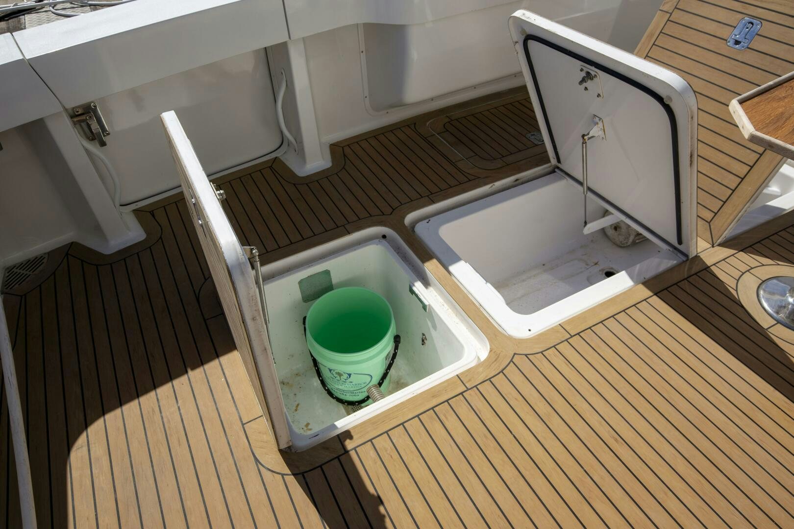 a small green bucket in a small sink aboard PRIME TIME Yacht for Sale