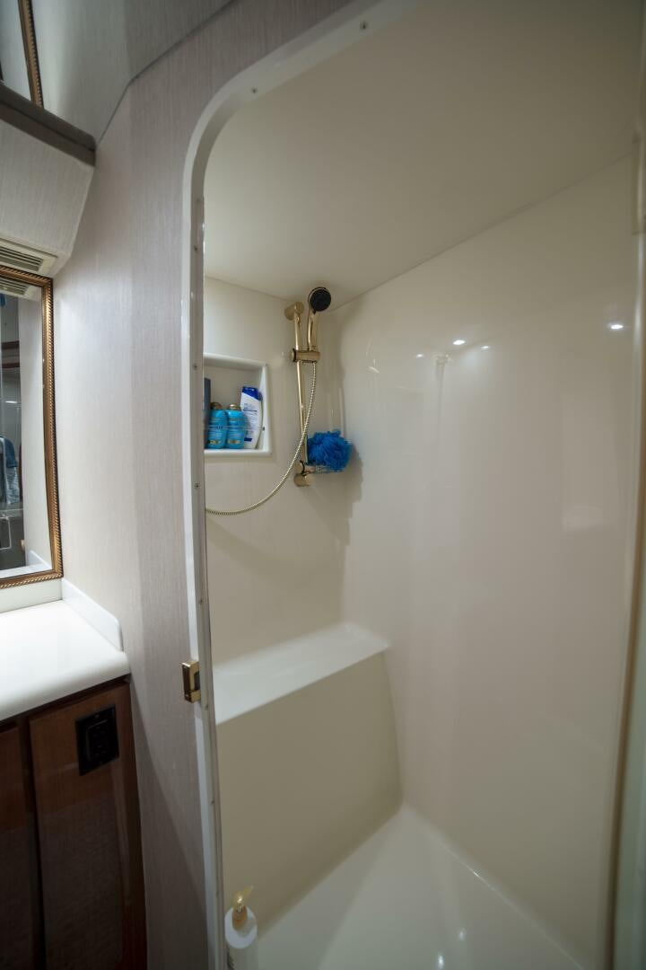 a bathroom with a shower and a sink aboard PRIME TIME Yacht for Sale