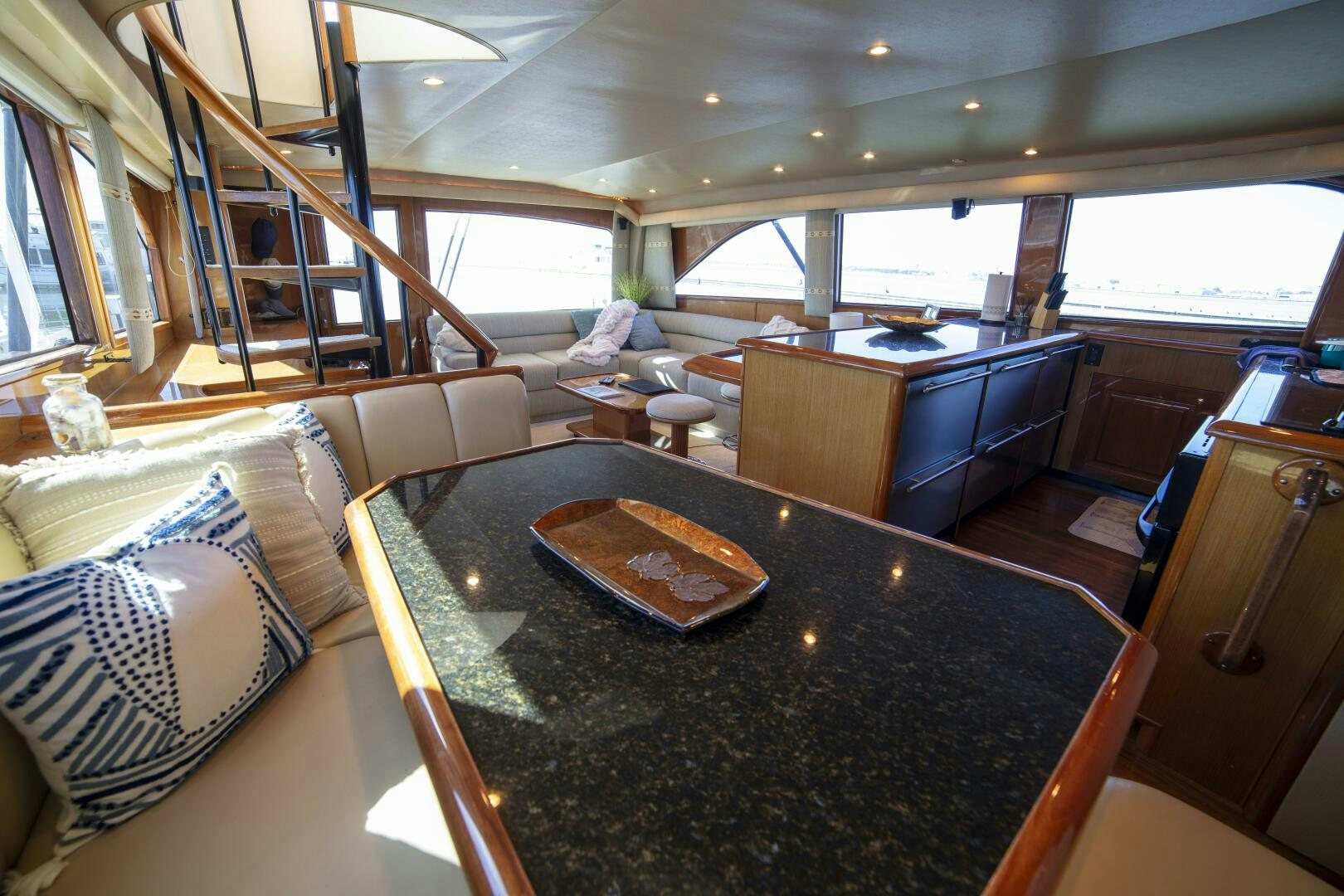 a large living room with a large window aboard PRIME TIME Yacht for Sale