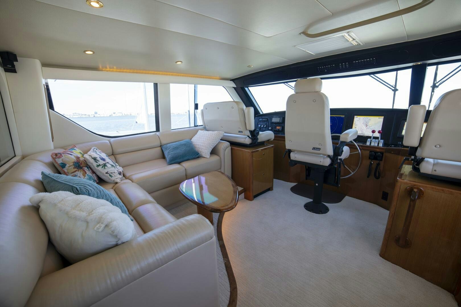 a room with a couch and a television aboard PRIME TIME Yacht for Sale