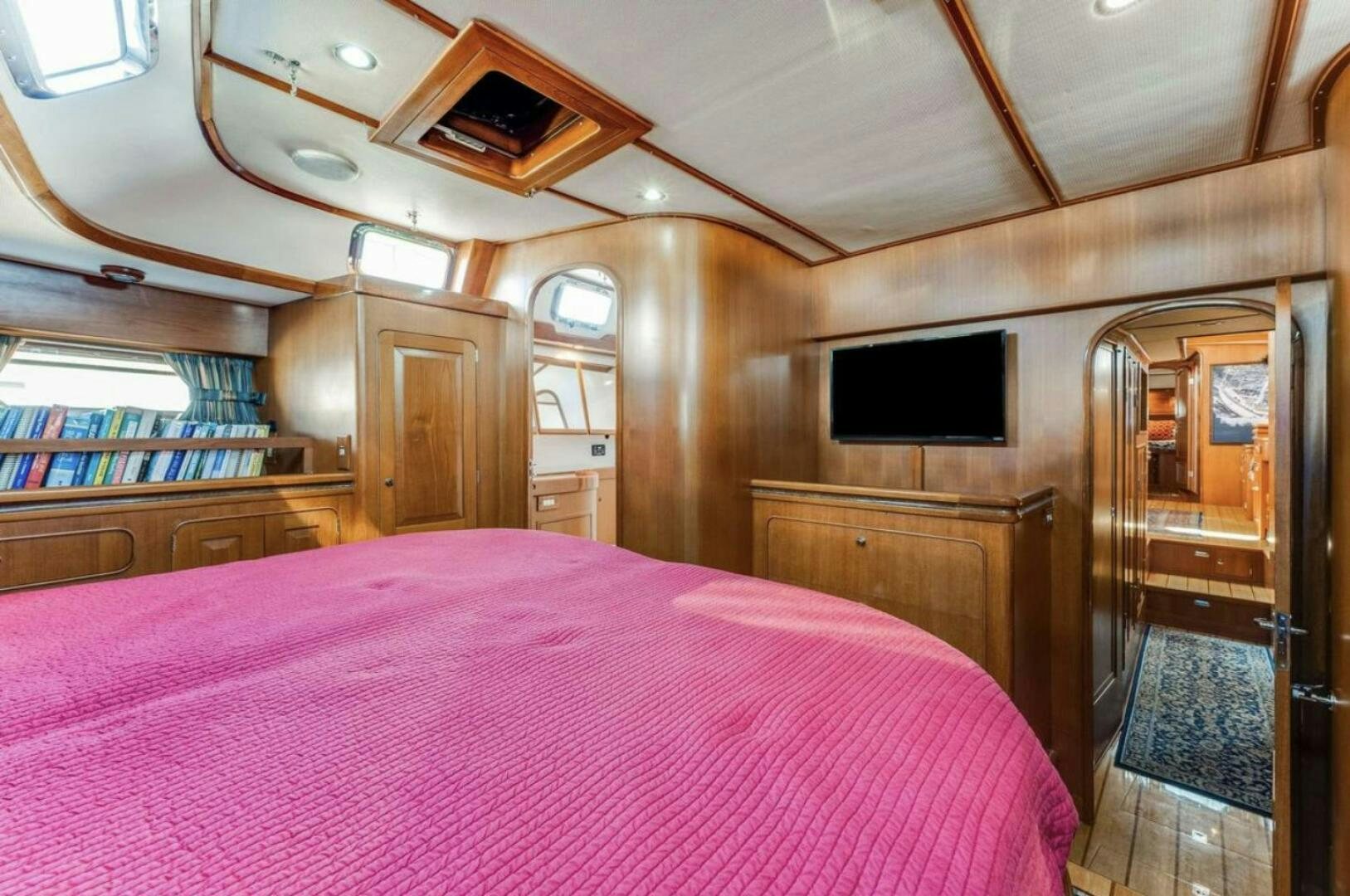 a bedroom with a large bed aboard PERFECT SYMMETRY 5 Yacht for Sale