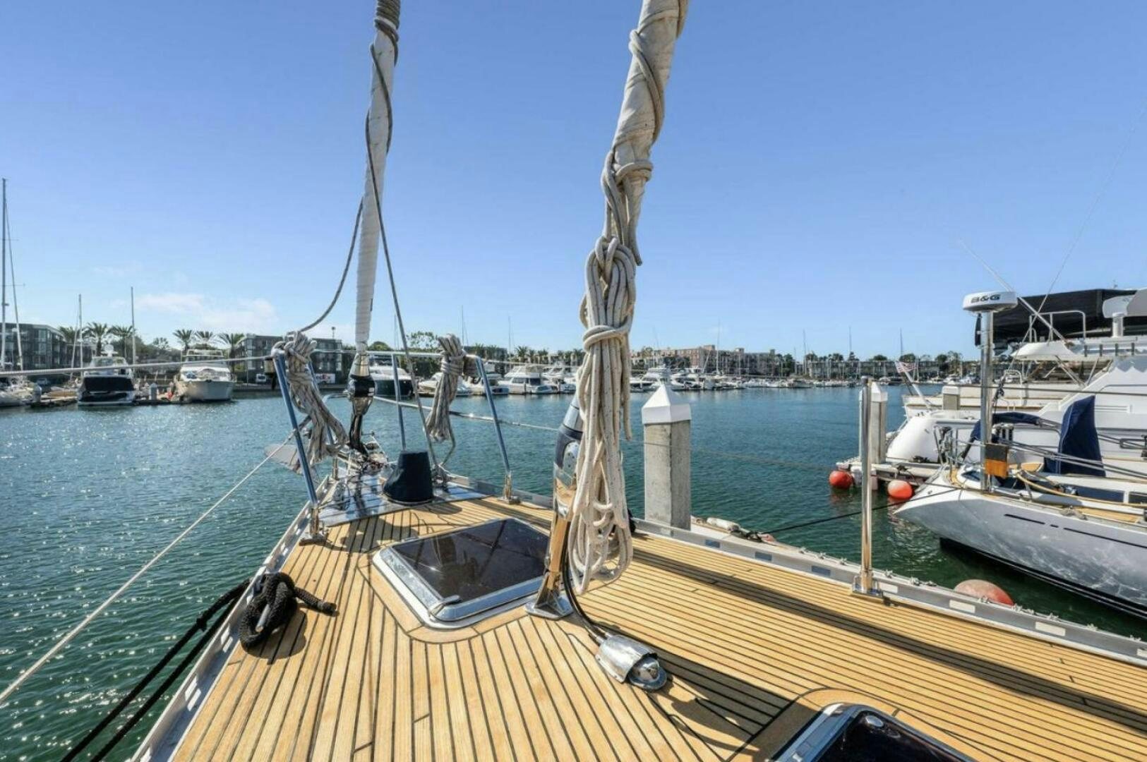 a sailboat docked at a pier aboard PERFECT SYMMETRY 5 Yacht for Sale
