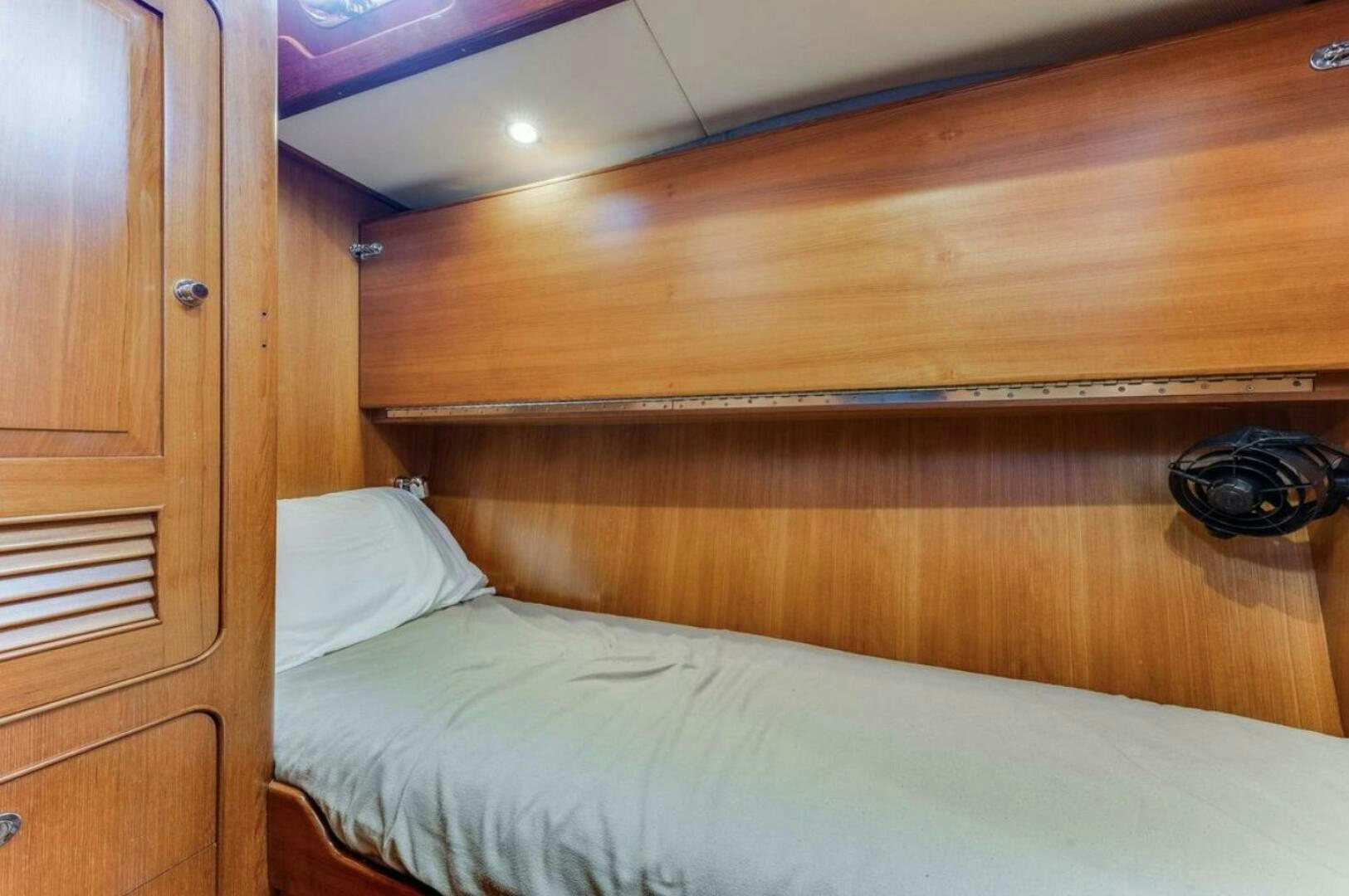 a bed with a white comforter aboard PERFECT SYMMETRY 5 Yacht for Sale