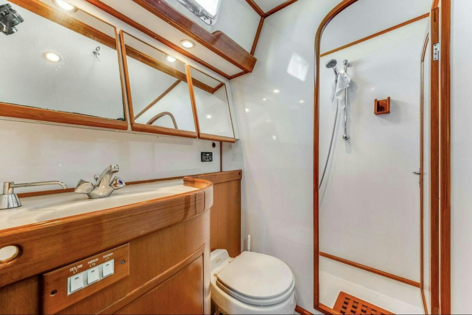 a bathroom with a toilet and a sink aboard PERFECT SYMMETRY 5 Yacht for Sale