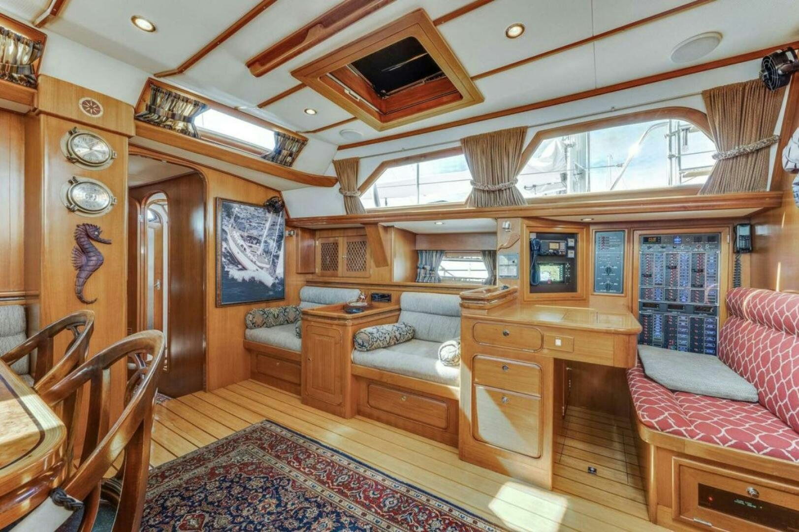 a living room with a wood floor aboard PERFECT SYMMETRY 5 Yacht for Sale