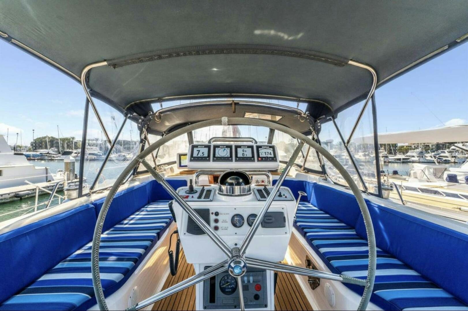 a boat is parked in a harbor aboard PERFECT SYMMETRY 5 Yacht for Sale