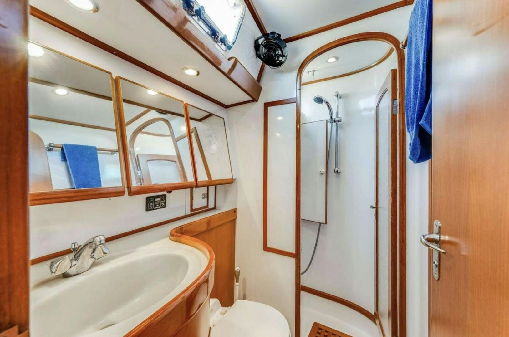 a bathroom with a sink and a toilet aboard PERFECT SYMMETRY 5 Yacht for Sale