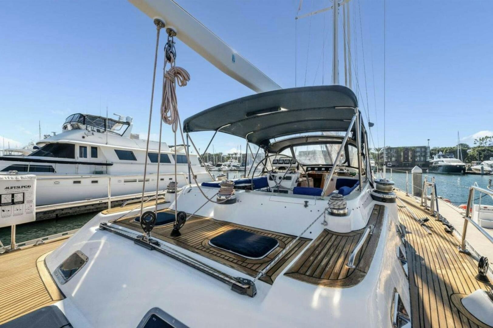 a boat docked at a pier aboard PERFECT SYMMETRY 5 Yacht for Sale