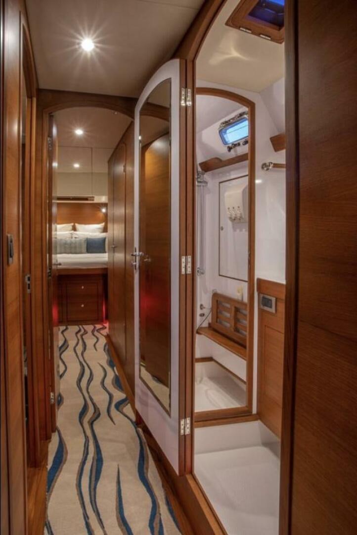 a hallway with a glass door aboard RAGNAR Yacht for Sale