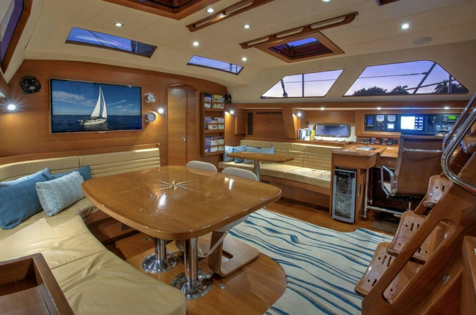 a room with a table and chairs aboard RAGNAR Yacht for Sale