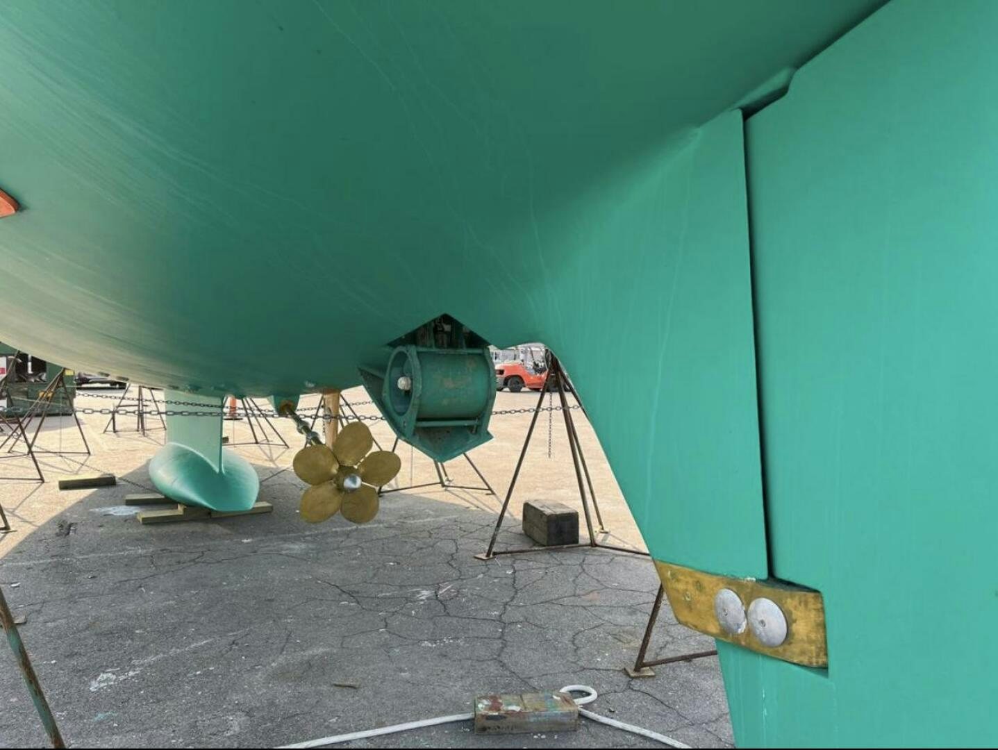 a room with a green wall and a drum set aboard RAGNAR Yacht for Sale