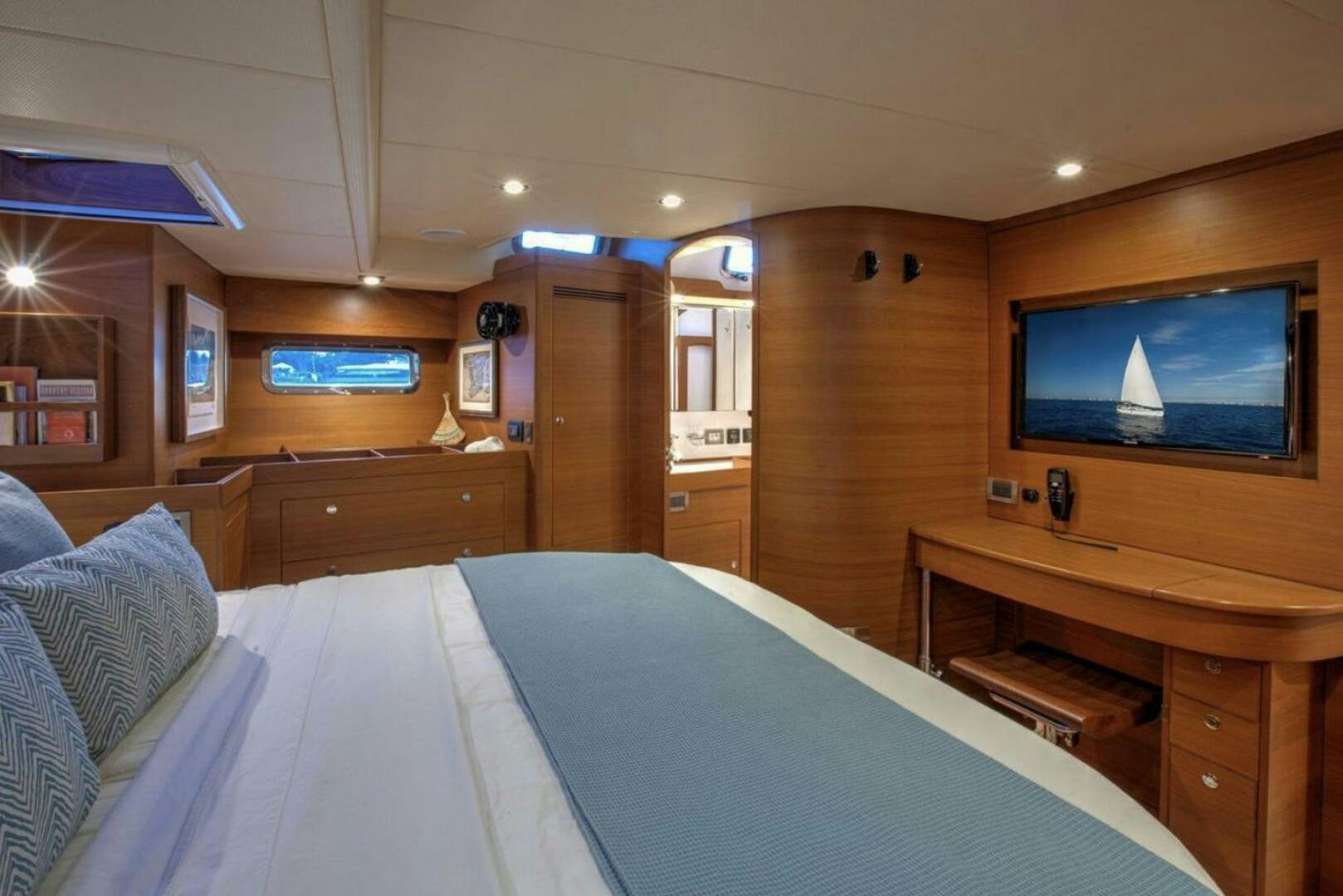 a hotel room with a bed and tv aboard RAGNAR Yacht for Sale
