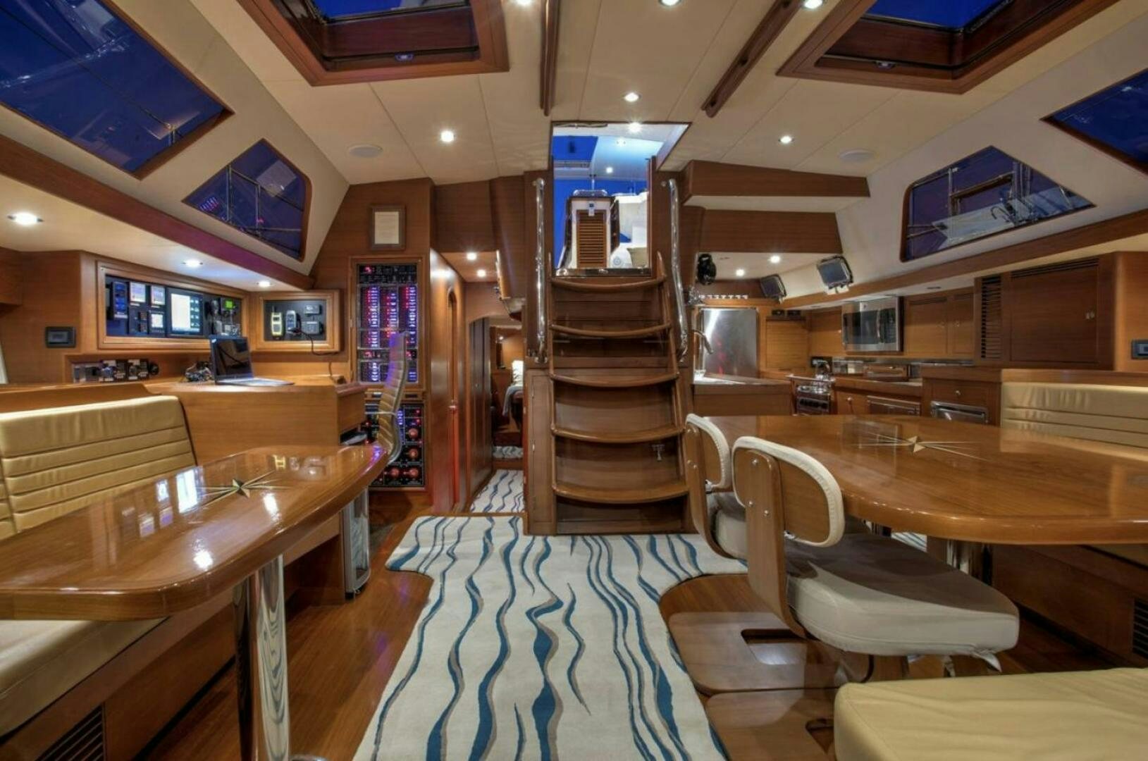 a room with a bunk bed and a table aboard RAGNAR Yacht for Sale