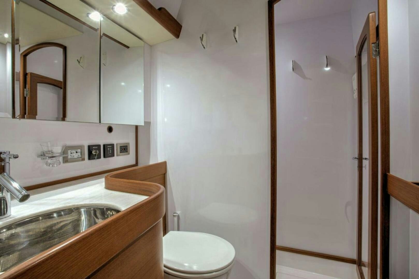a bathroom with a sink toilet and a shower aboard RAGNAR Yacht for Sale