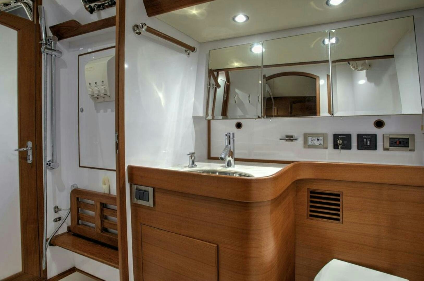a bathroom with a sink and mirror aboard RAGNAR Yacht for Sale
