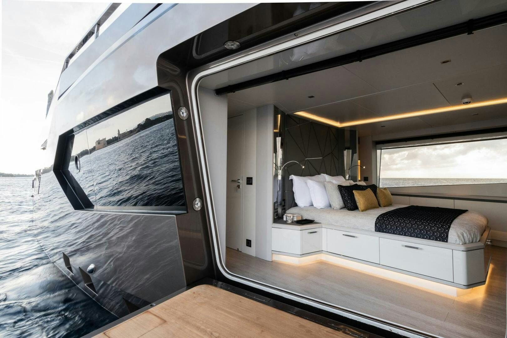 a room with a bed and a window aboard BEACH CLUB Yacht for Sale