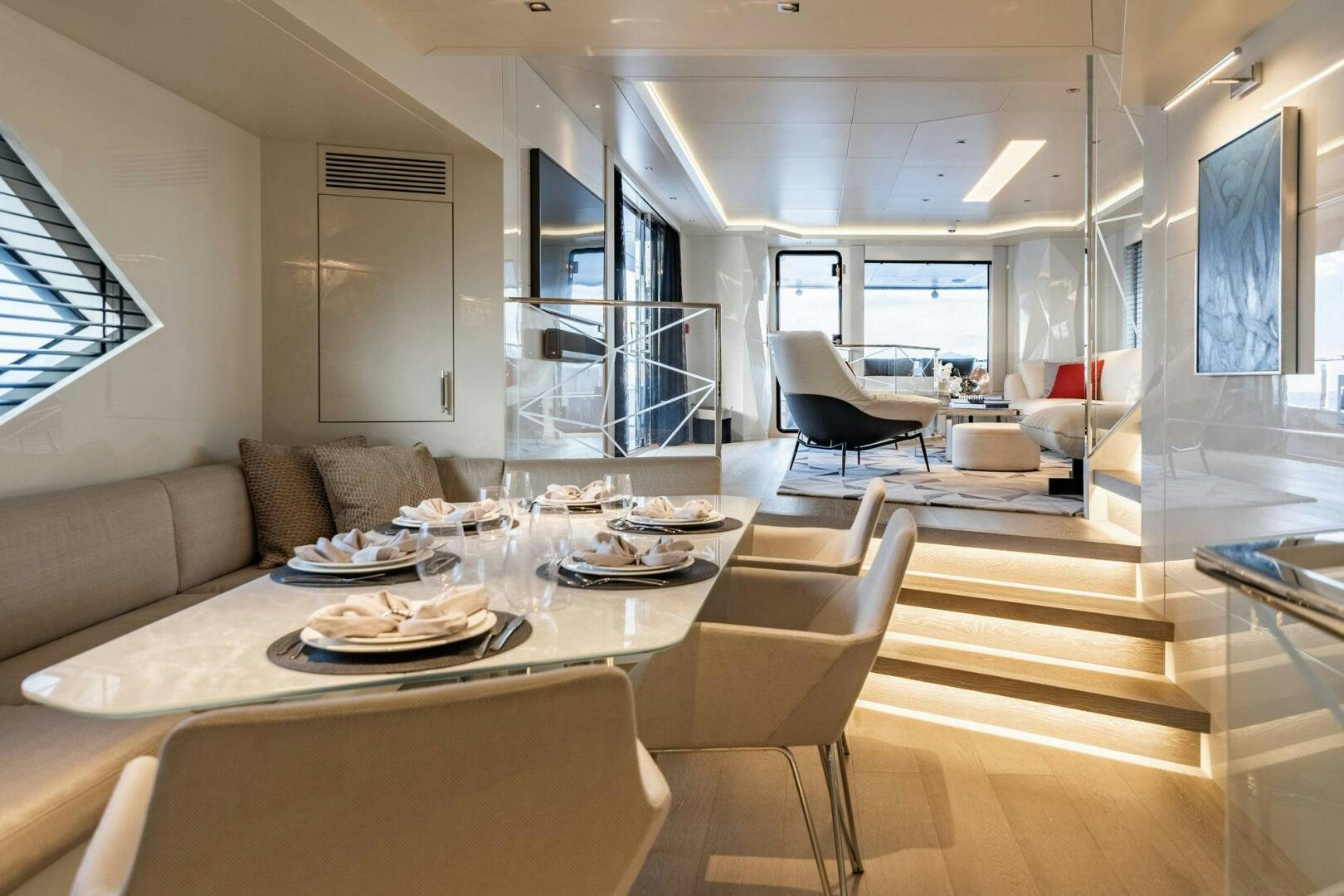 a large room with a table and chairs aboard BEACH CLUB Yacht for Sale