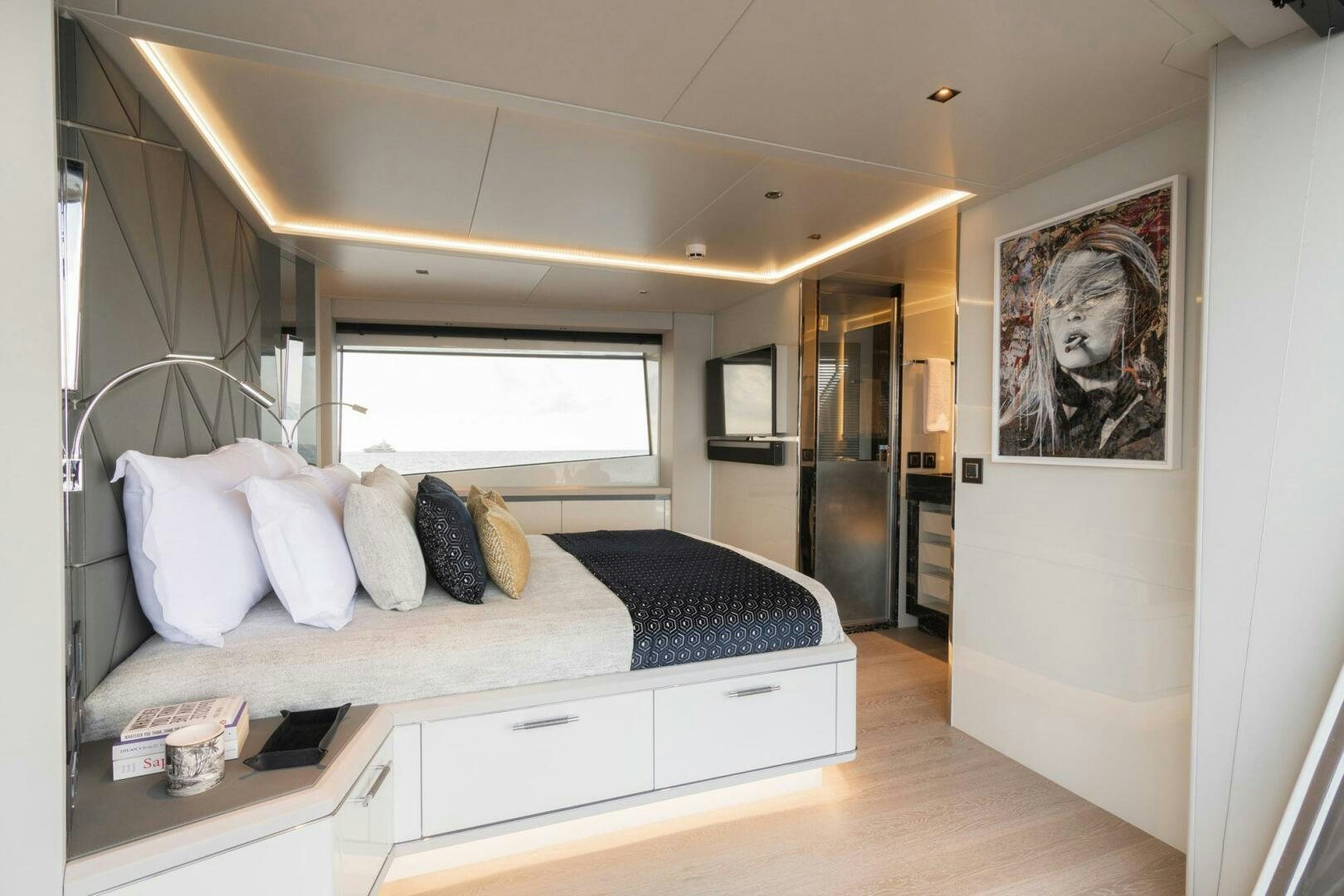 a bedroom with a bed and a television aboard BEACH CLUB Yacht for Sale