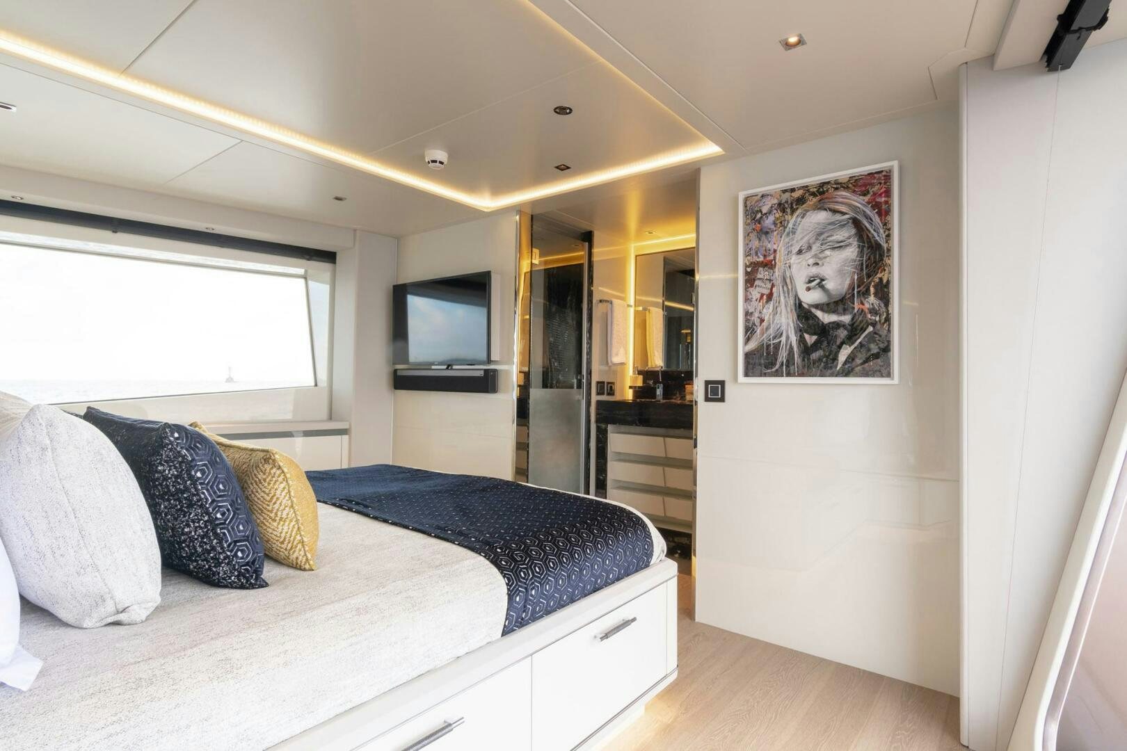 a bedroom with a bed and a television aboard BEACH CLUB Yacht for Sale