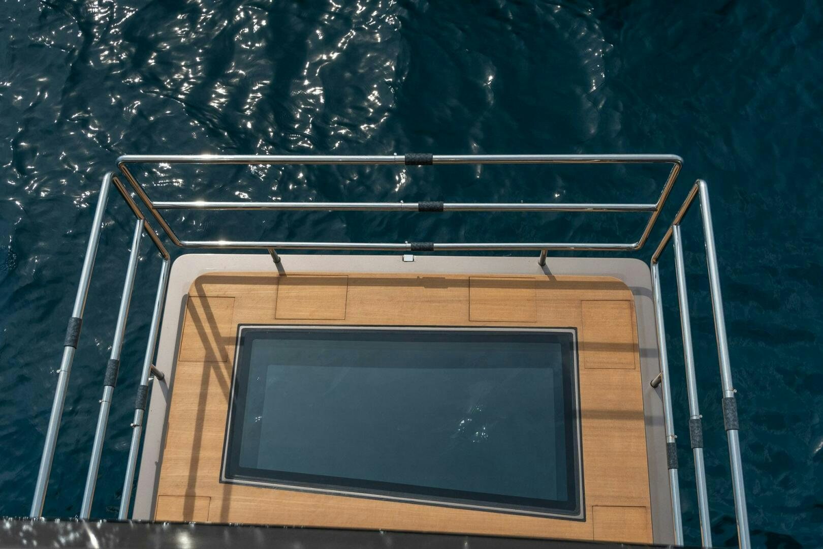 a tv on a wooden platform aboard BEACH CLUB Yacht for Sale