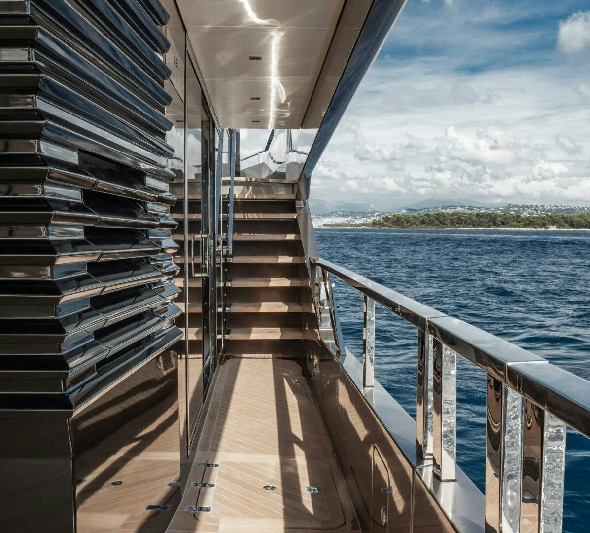 a large boat on the water aboard BEACH CLUB Yacht for Sale