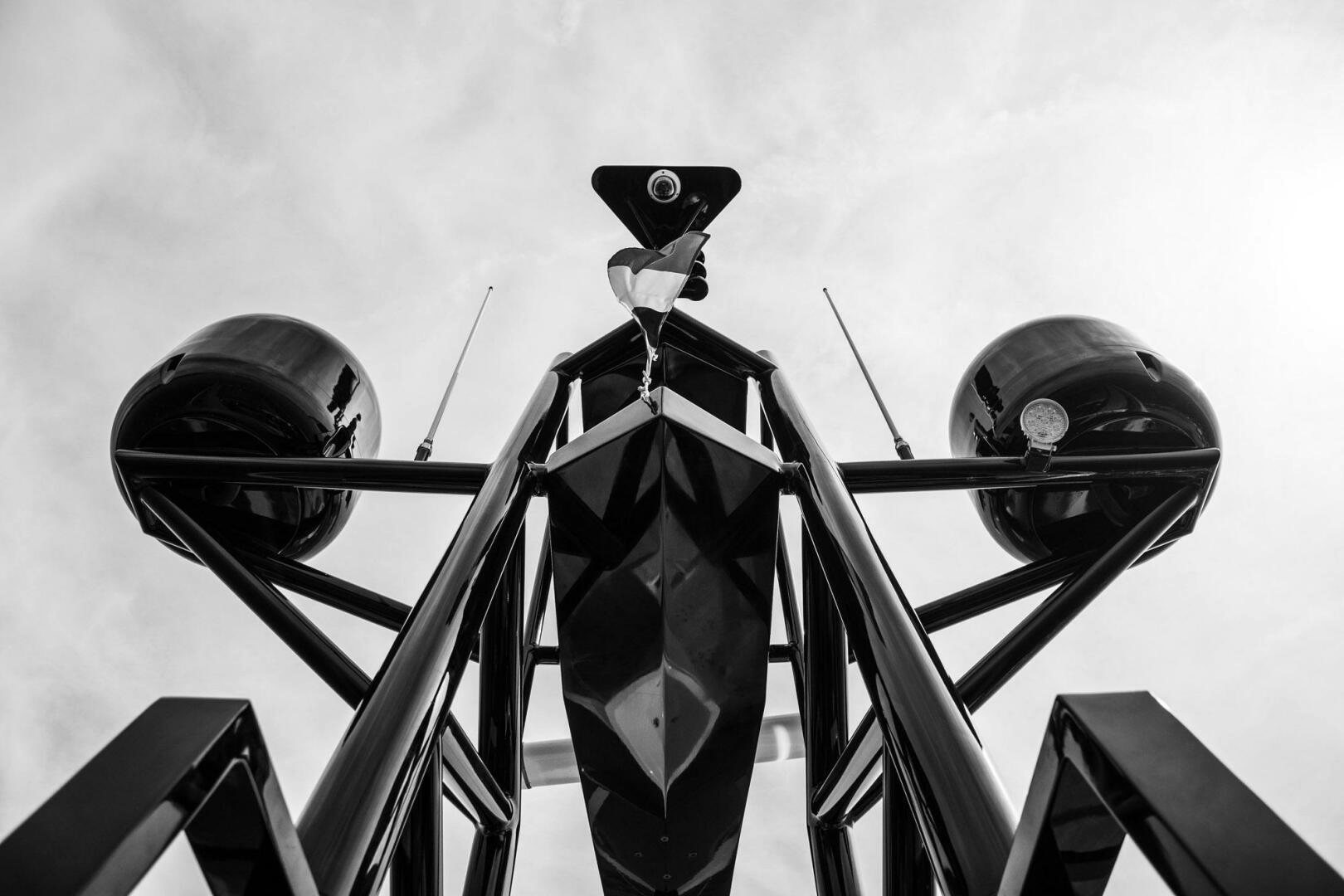 a large metal structure with a satellite on top aboard BEACH CLUB Yacht for Sale