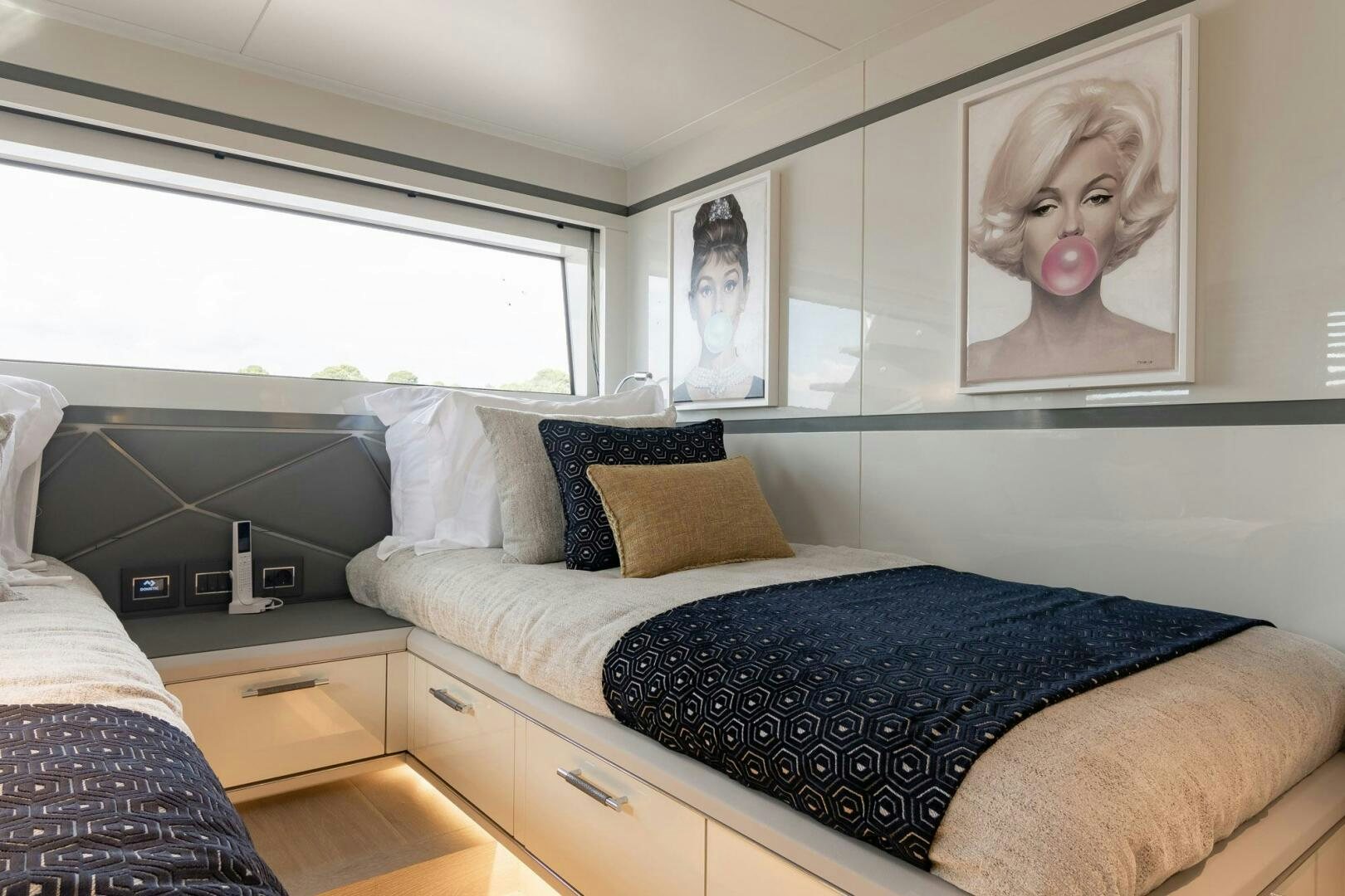 a bed with a blue blanket aboard BEACH CLUB Yacht for Sale