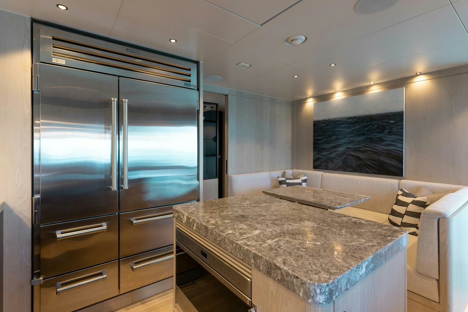 a large kitchen with a large glass shower unit aboard UNTETHERED Yacht for Sale