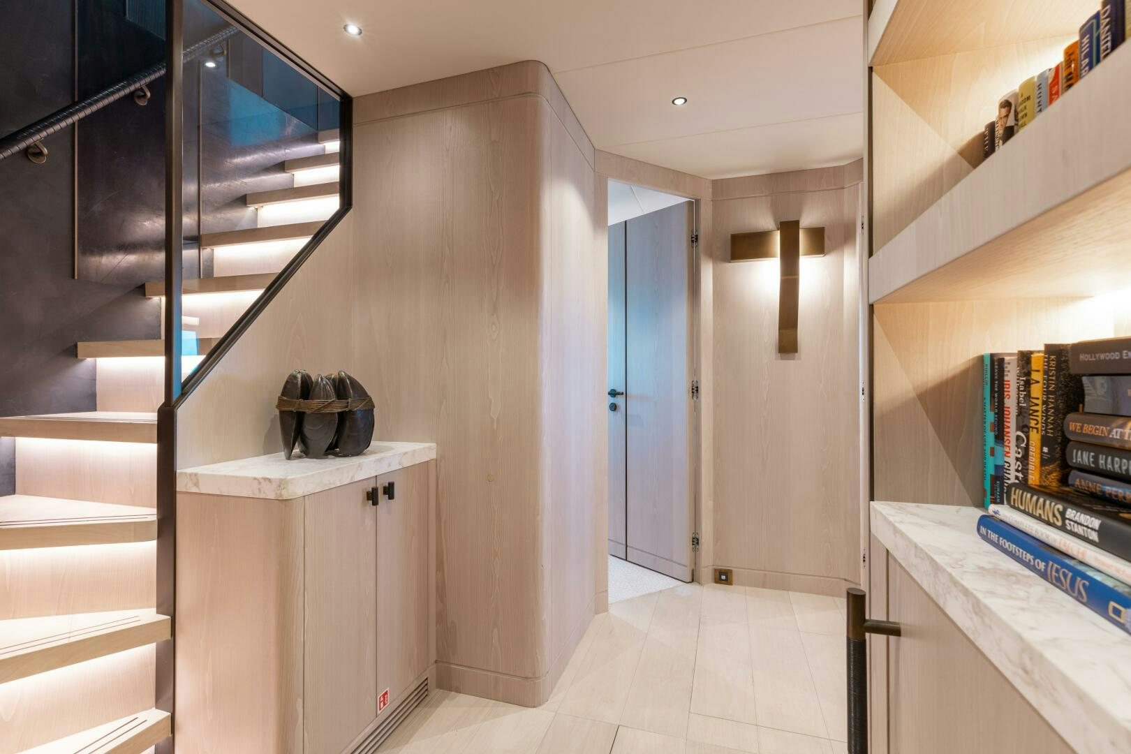 a room with shelves and a black box on the wall aboard UNTETHERED Yacht for Sale