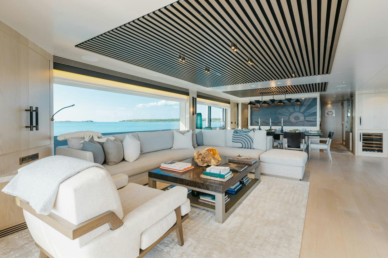 a living room with a large open window aboard UNTETHERED Yacht for Sale