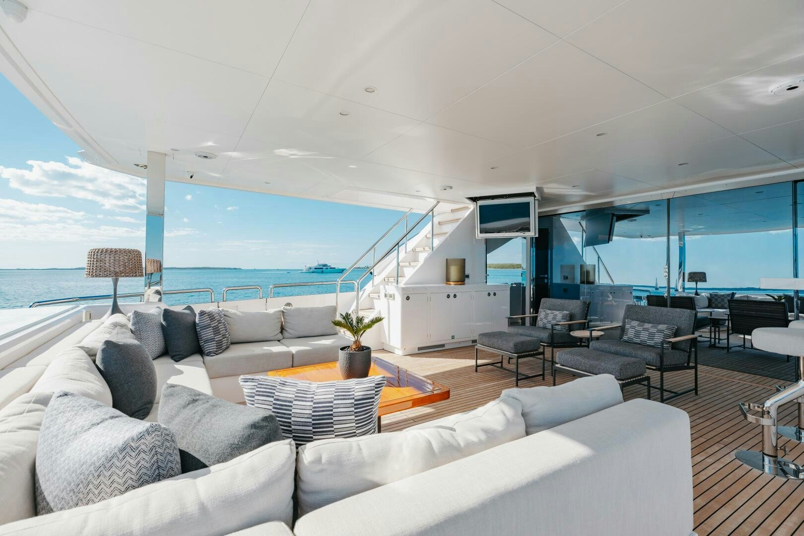 a living room with a large balcony aboard UNTETHERED Yacht for Sale