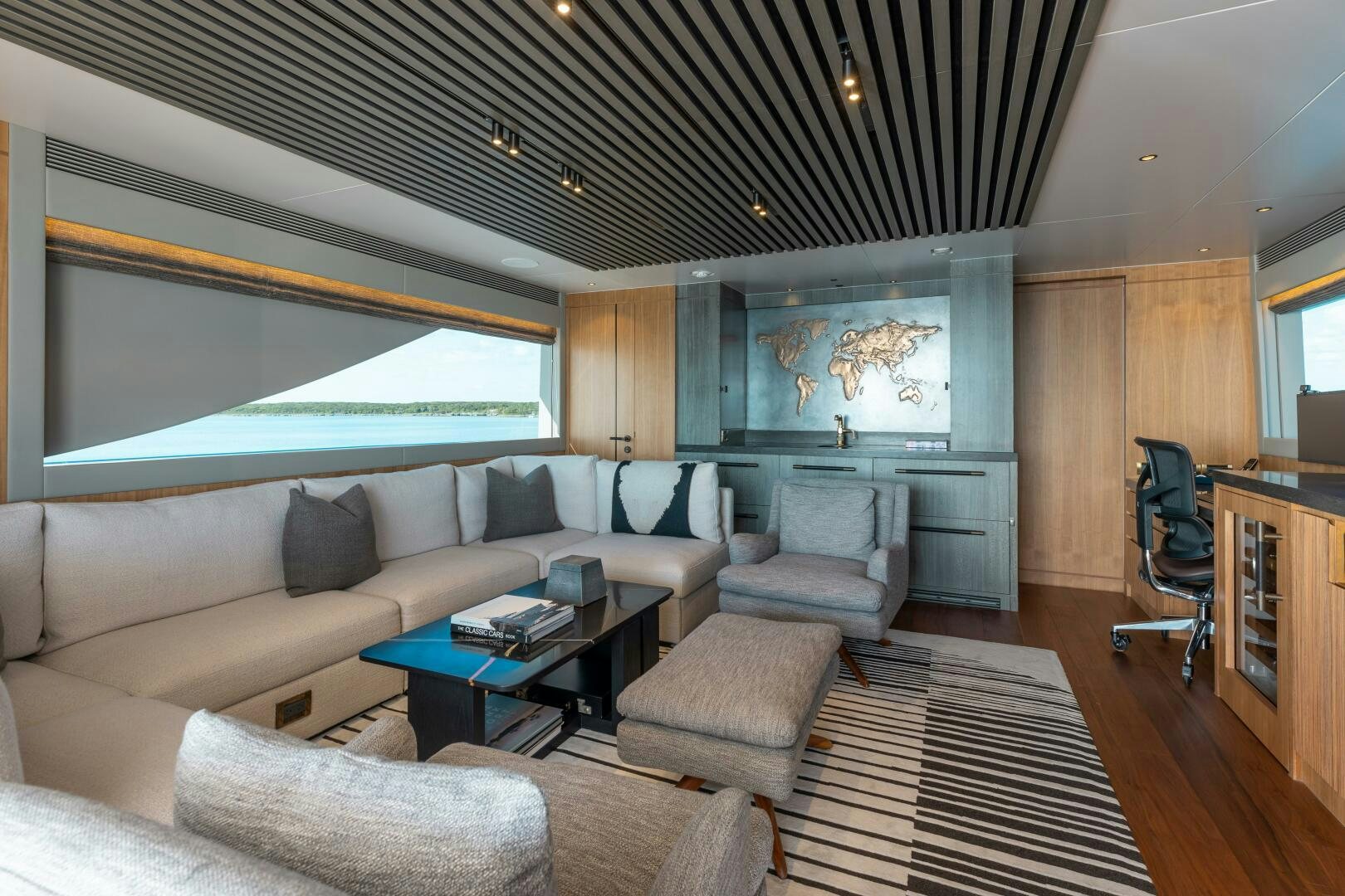 a living room with a couch and a coffee table aboard UNTETHERED Yacht for Sale