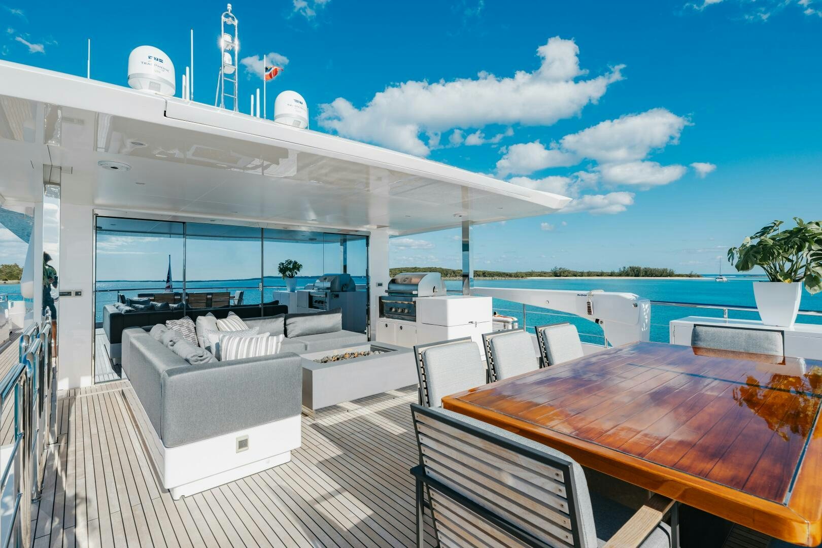 a large room with tables and chairs aboard UNTETHERED Yacht for Sale