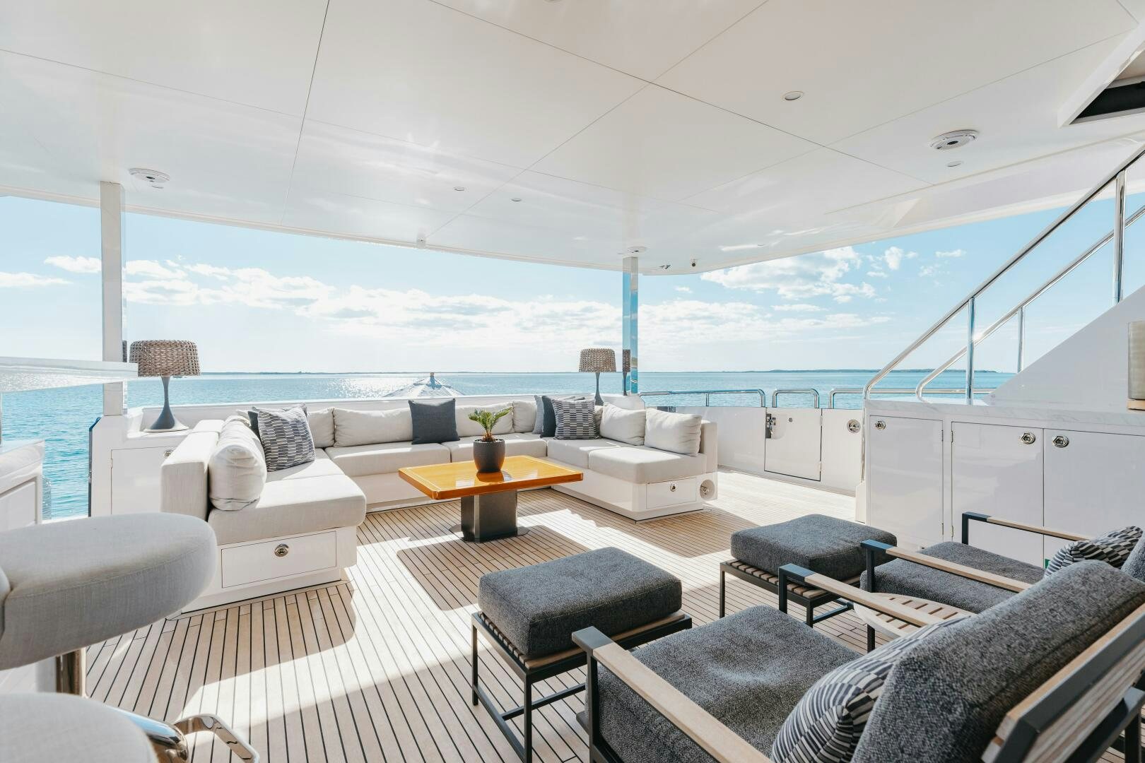 a living room with a large balcony aboard UNTETHERED Yacht for Sale