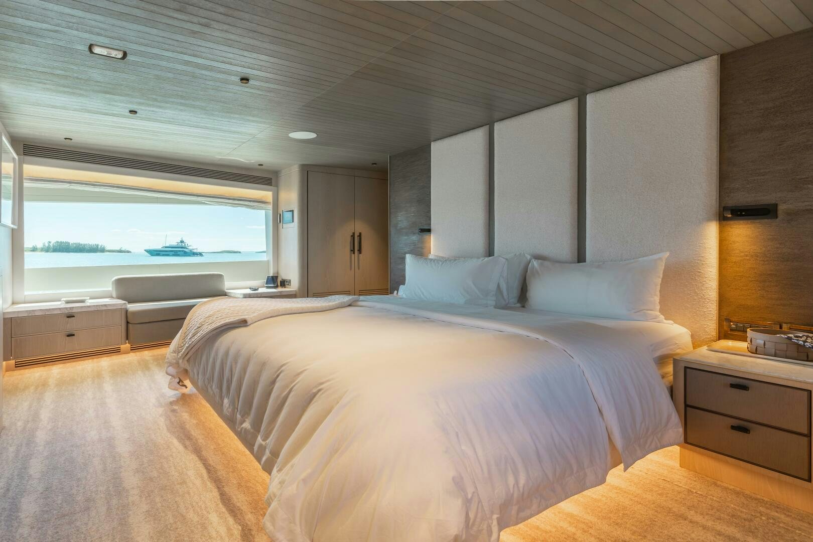 a large bed in a room aboard UNTETHERED Yacht for Sale