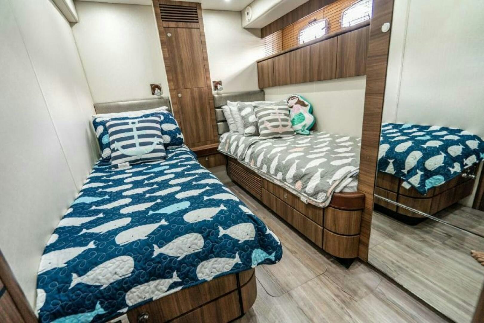 a room with two beds aboard AQUABELLA Yacht for Sale