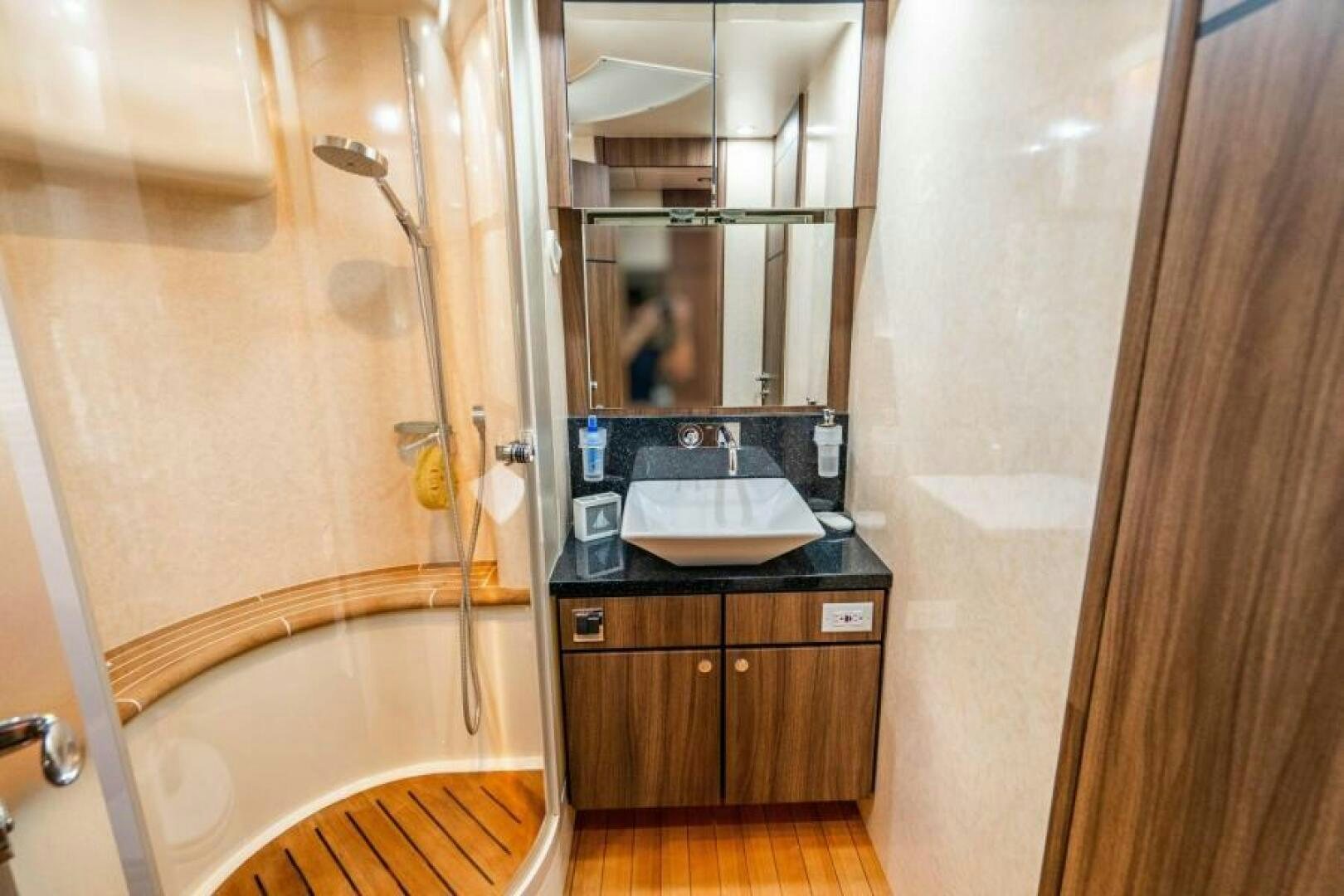 a bathroom with a sink and a bathtub aboard AQUABELLA Yacht for Sale