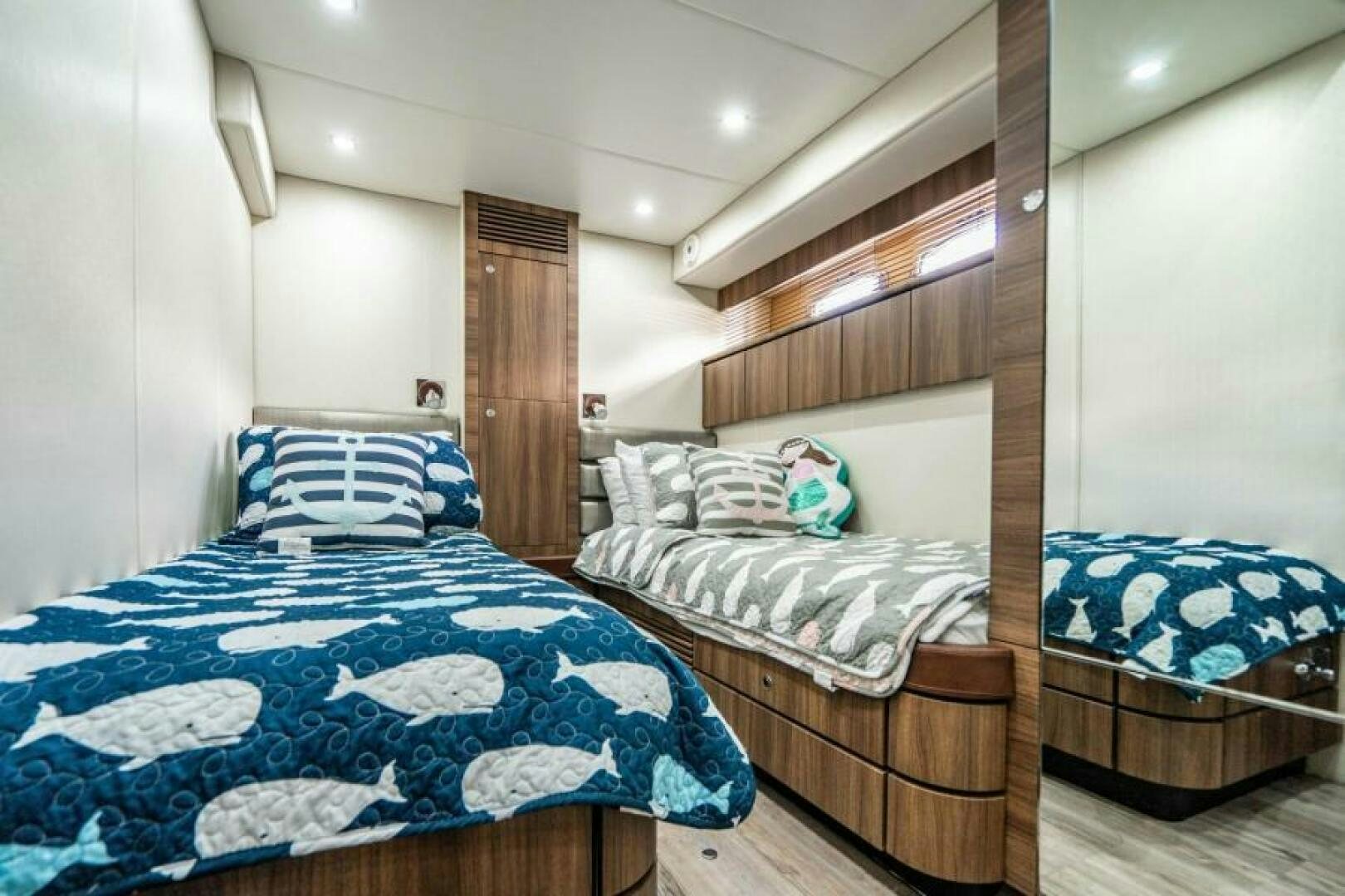 a couple of beds in a room aboard AQUABELLA Yacht for Sale