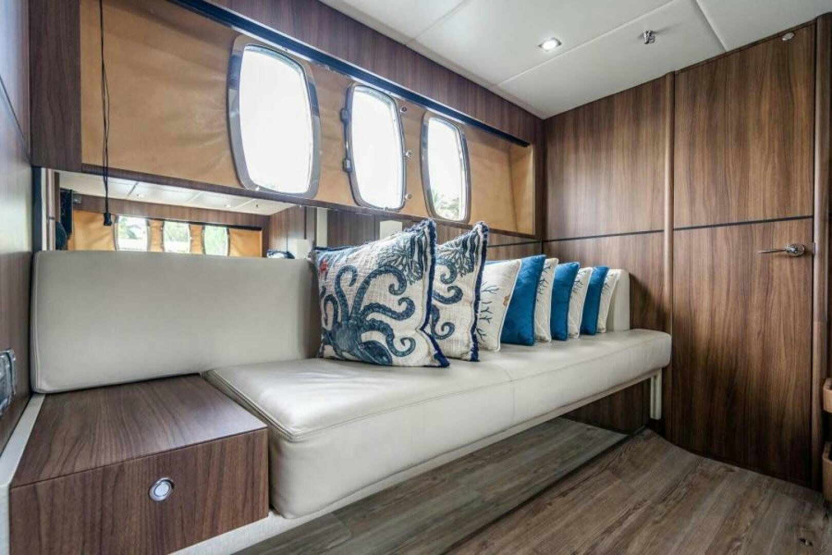 a couch in a cabin aboard AQUABELLA Yacht for Sale