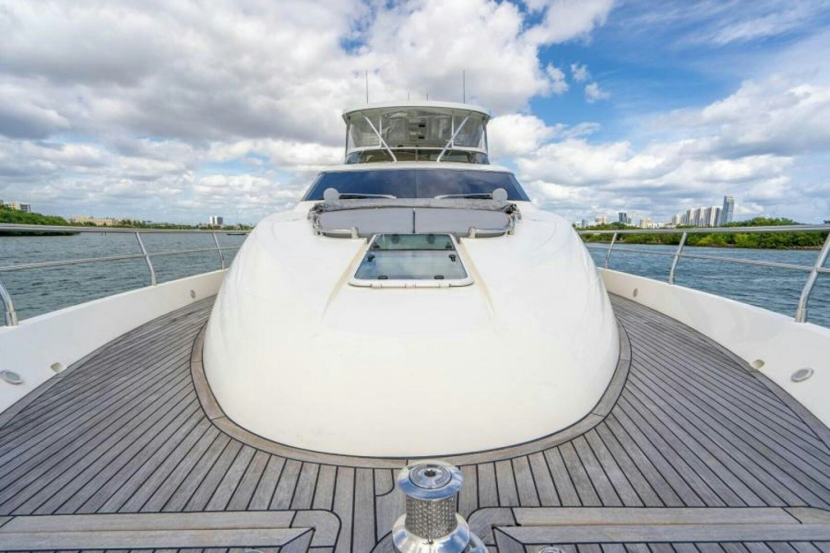 a white boat on a dock aboard AQUABELLA Yacht for Sale