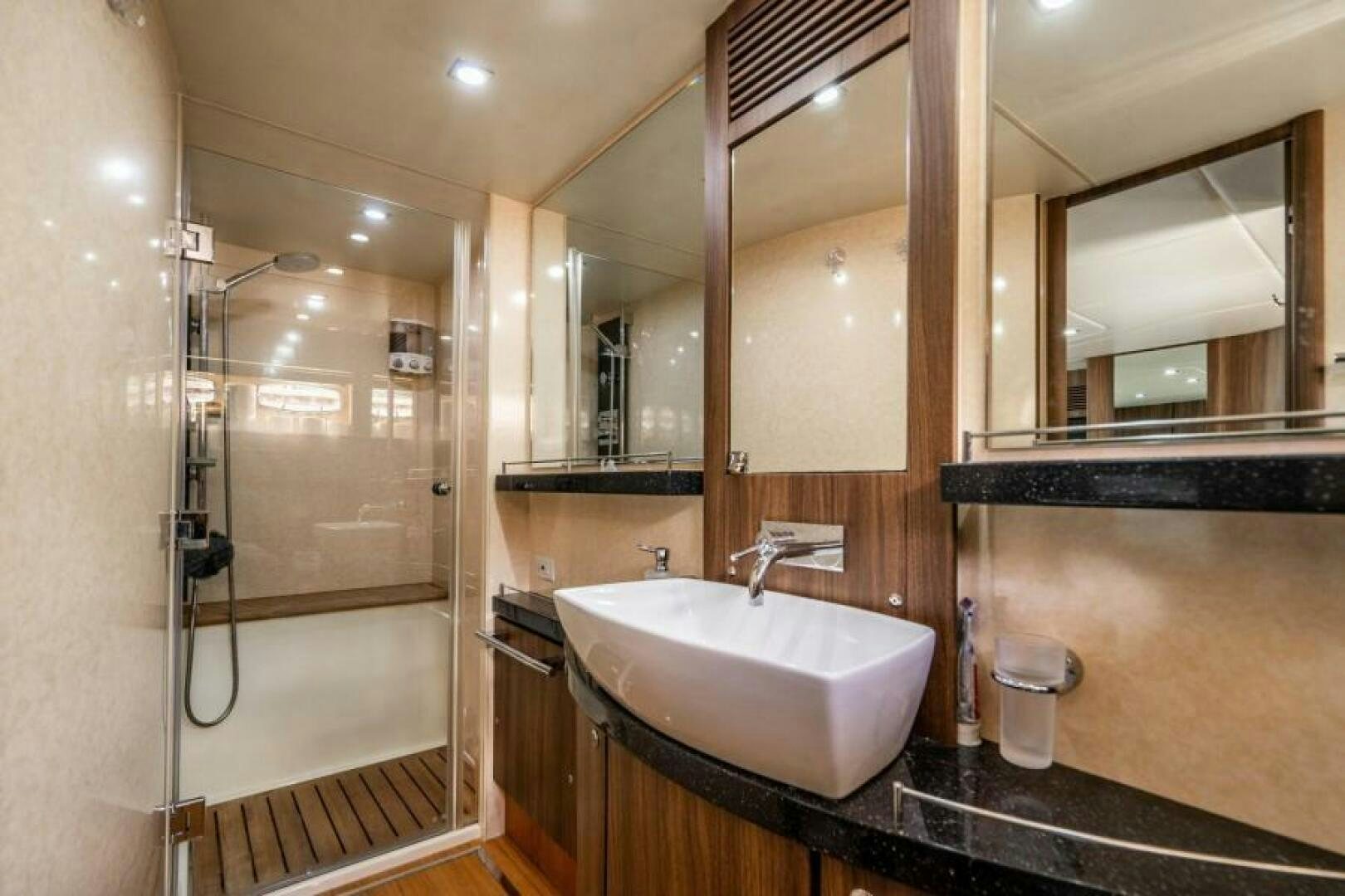 a bathroom with a sink and a shower aboard AQUABELLA Yacht for Sale