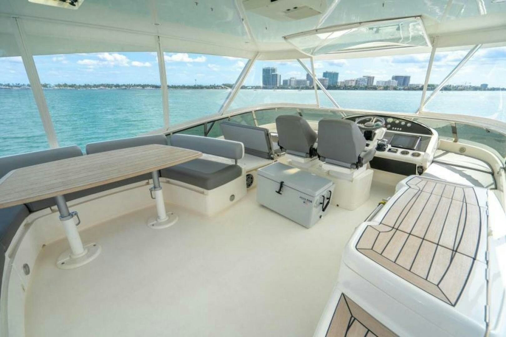 a room with a table and chairs aboard AQUABELLA Yacht for Sale