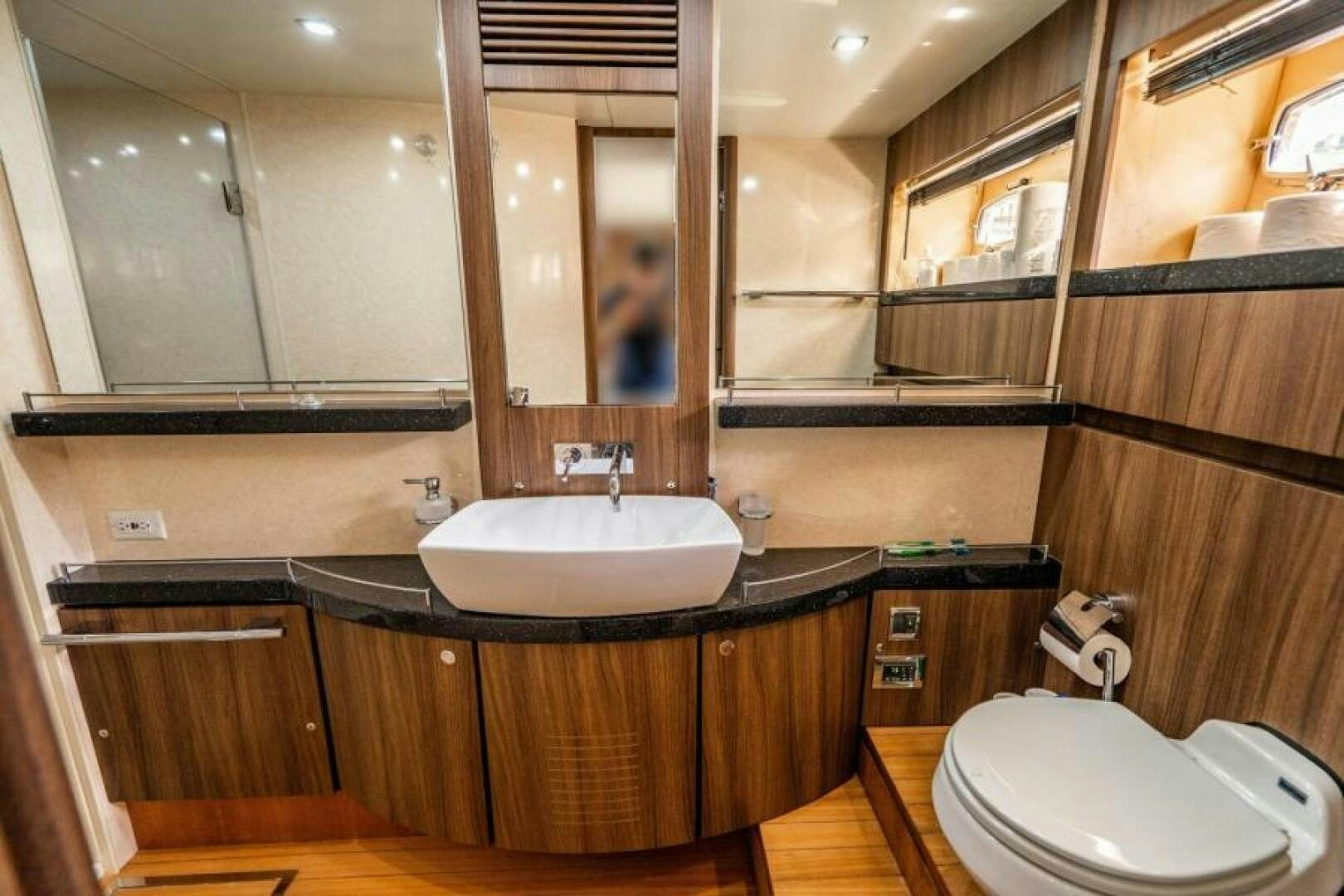 a bathroom with a sink and a toilet aboard AQUABELLA Yacht for Sale