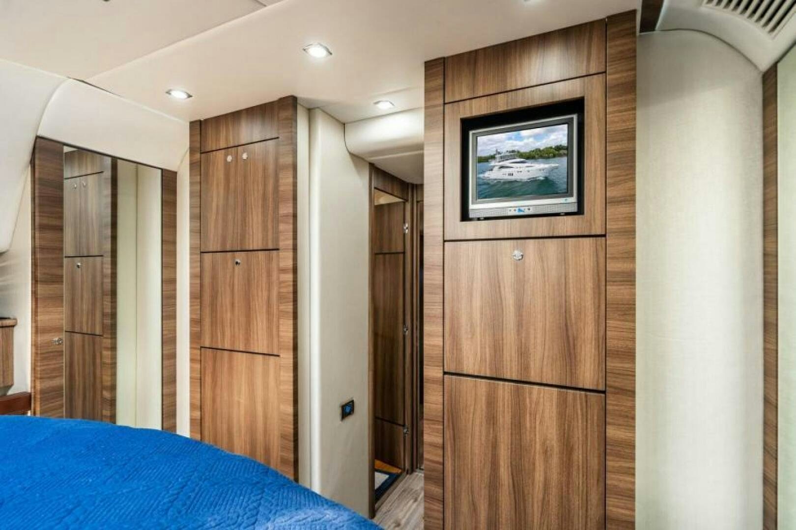 a room with a bed and a closet aboard AQUABELLA Yacht for Sale
