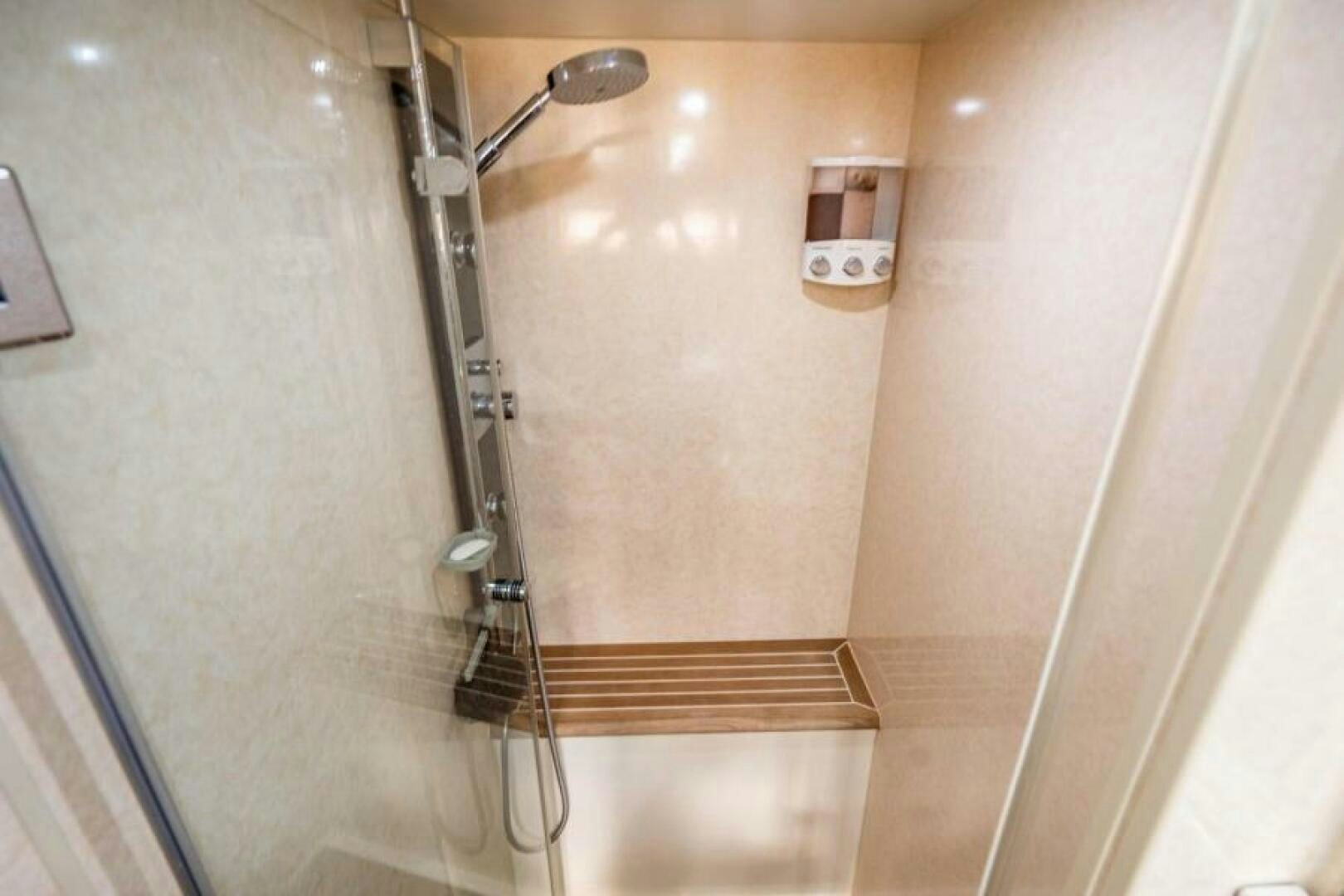 a shower with a glass door aboard AQUABELLA Yacht for Sale