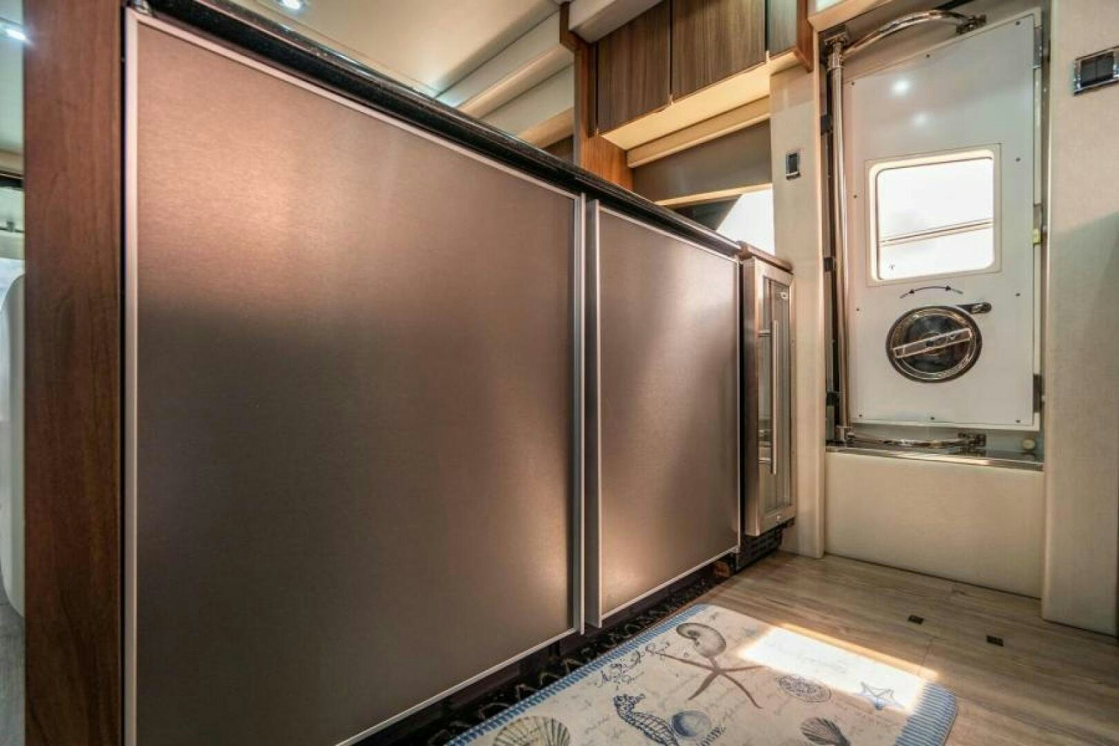 a large refrigerator in a kitchen aboard AQUABELLA Yacht for Sale