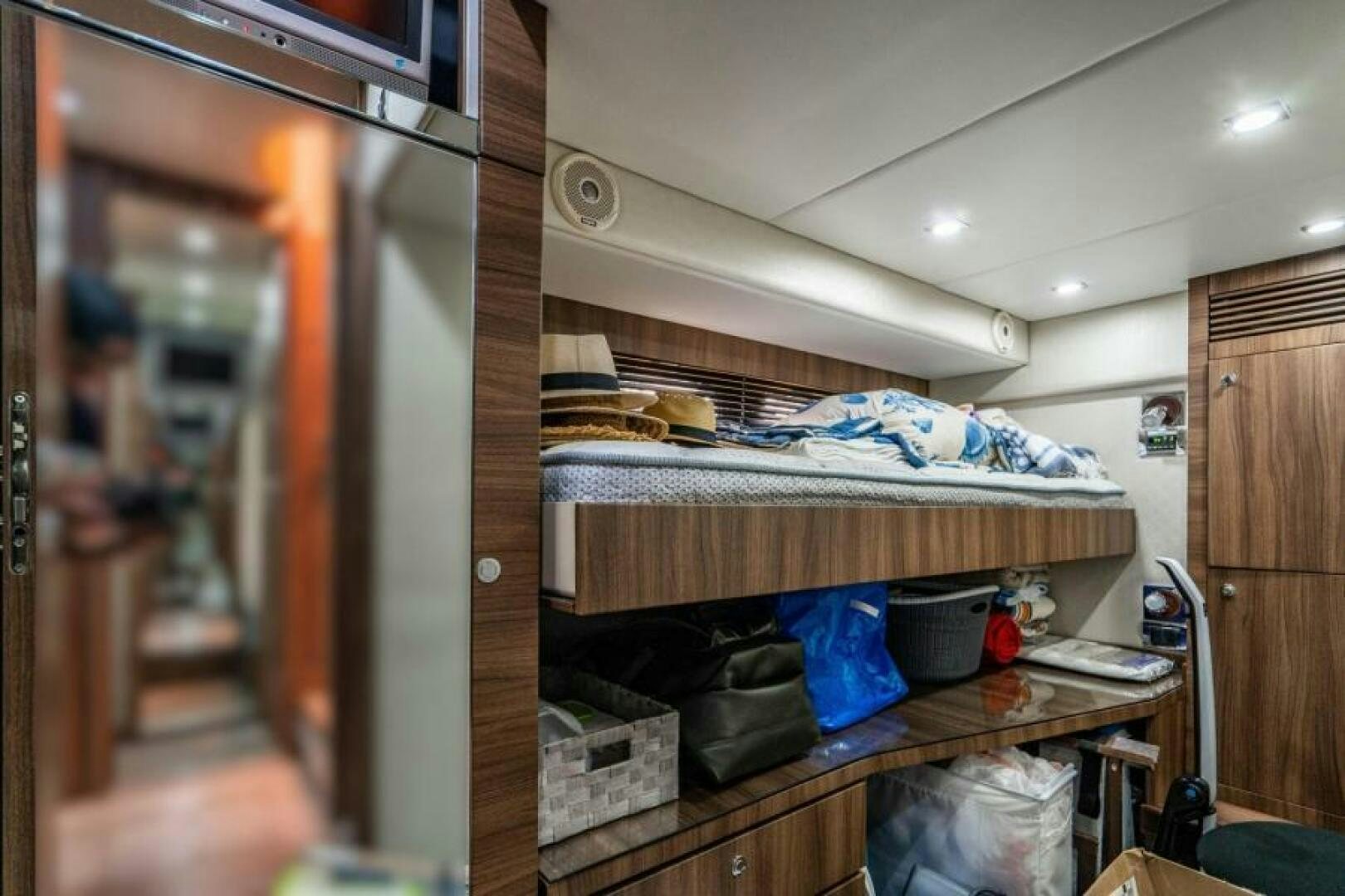 a room with a bed and a desk aboard AQUABELLA Yacht for Sale