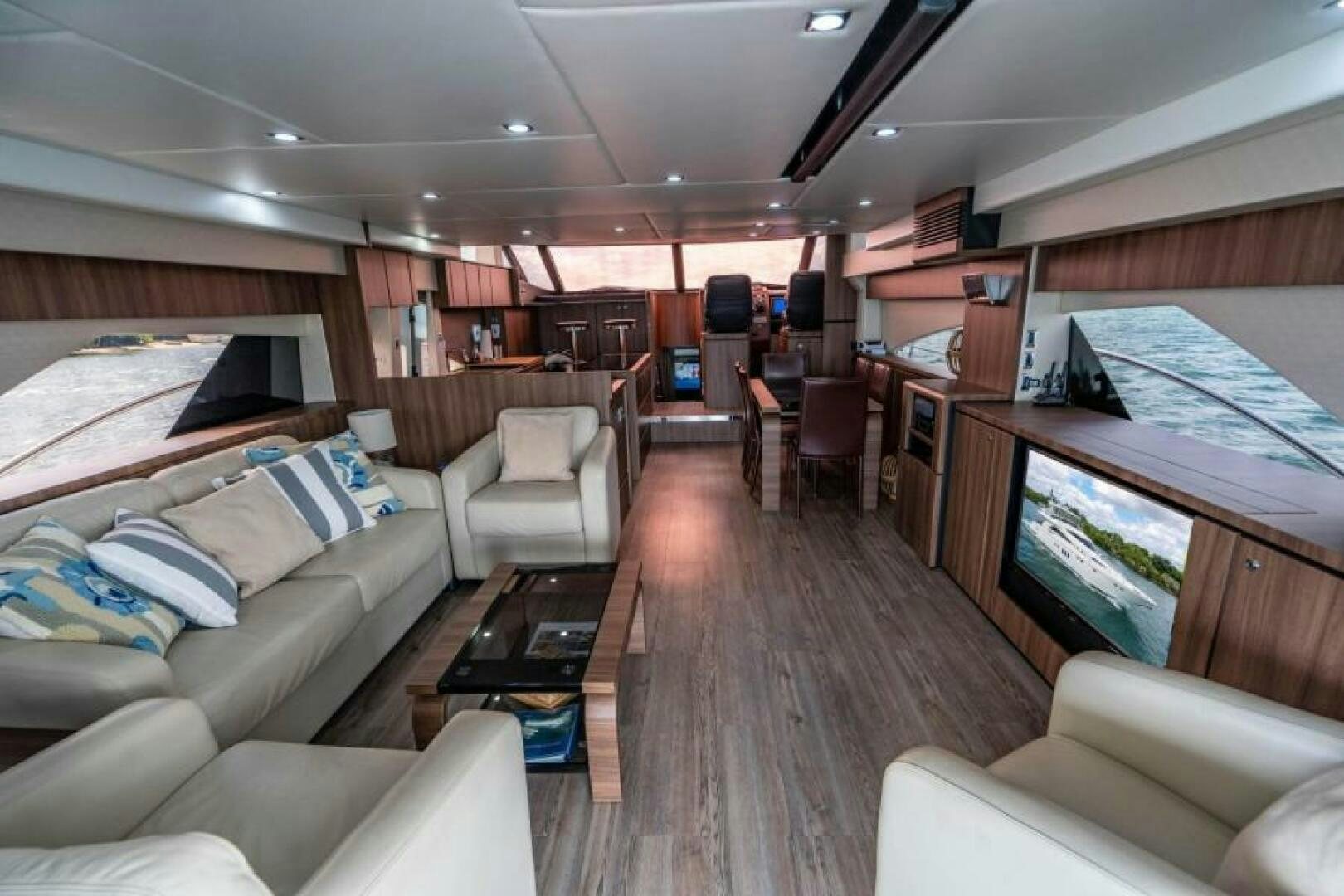 a living room with a large window aboard AQUABELLA Yacht for Sale