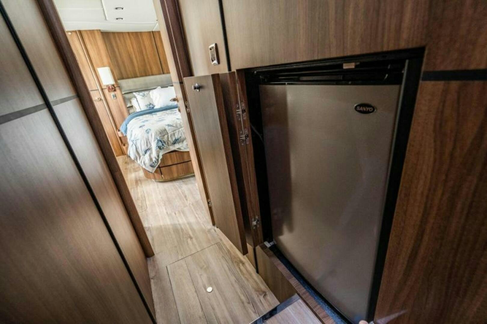 a room with a bed and a closet aboard AQUABELLA Yacht for Sale
